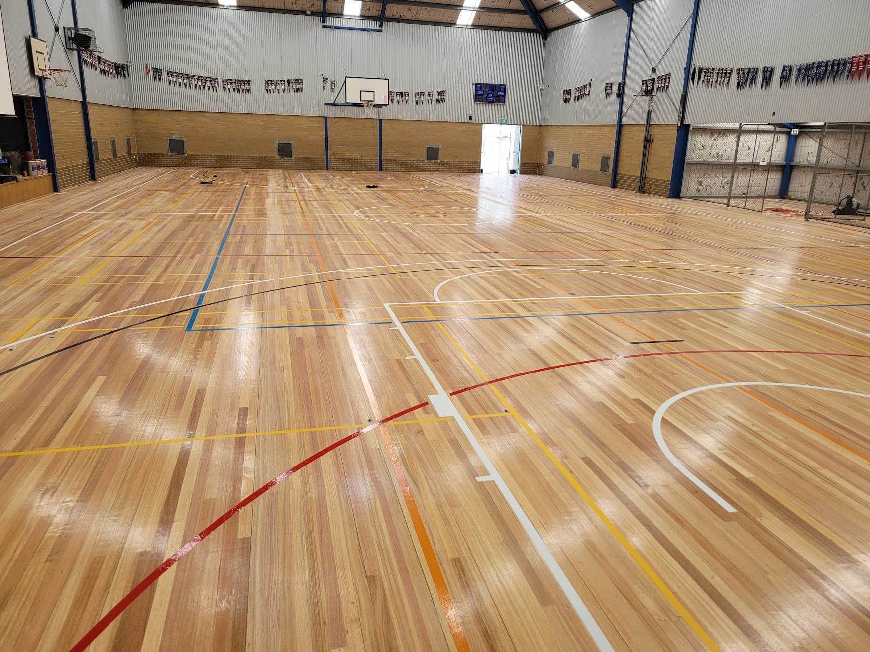 Professional sports floor recoating and maintenance service
